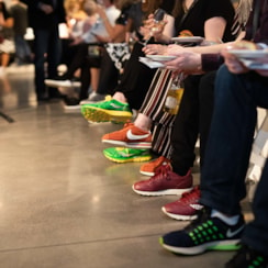 Circle of colorful sneakers worn by women